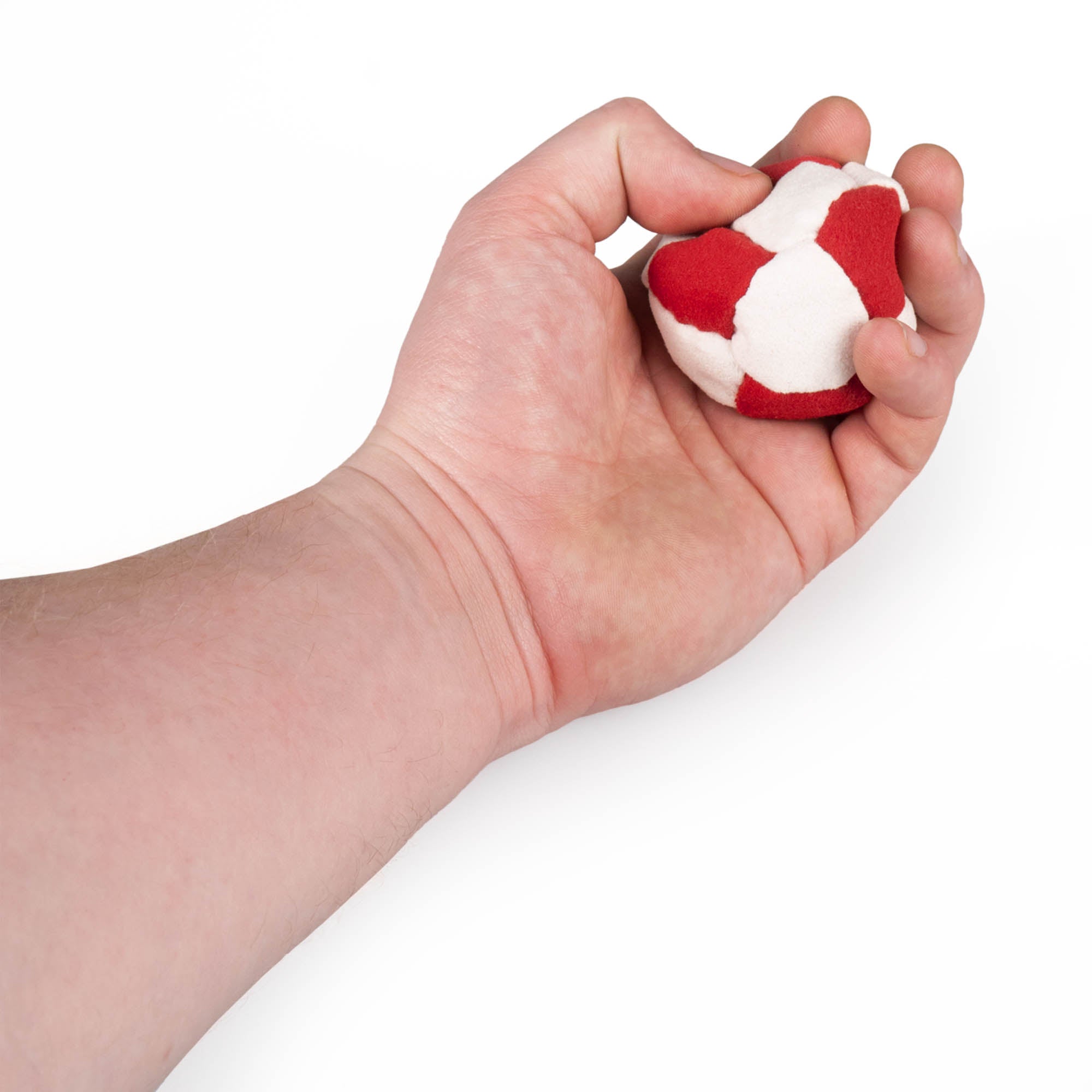 Red and white hacky sack in hand