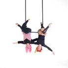 performers on extended trapeze