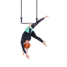 performer on shackle trapeze