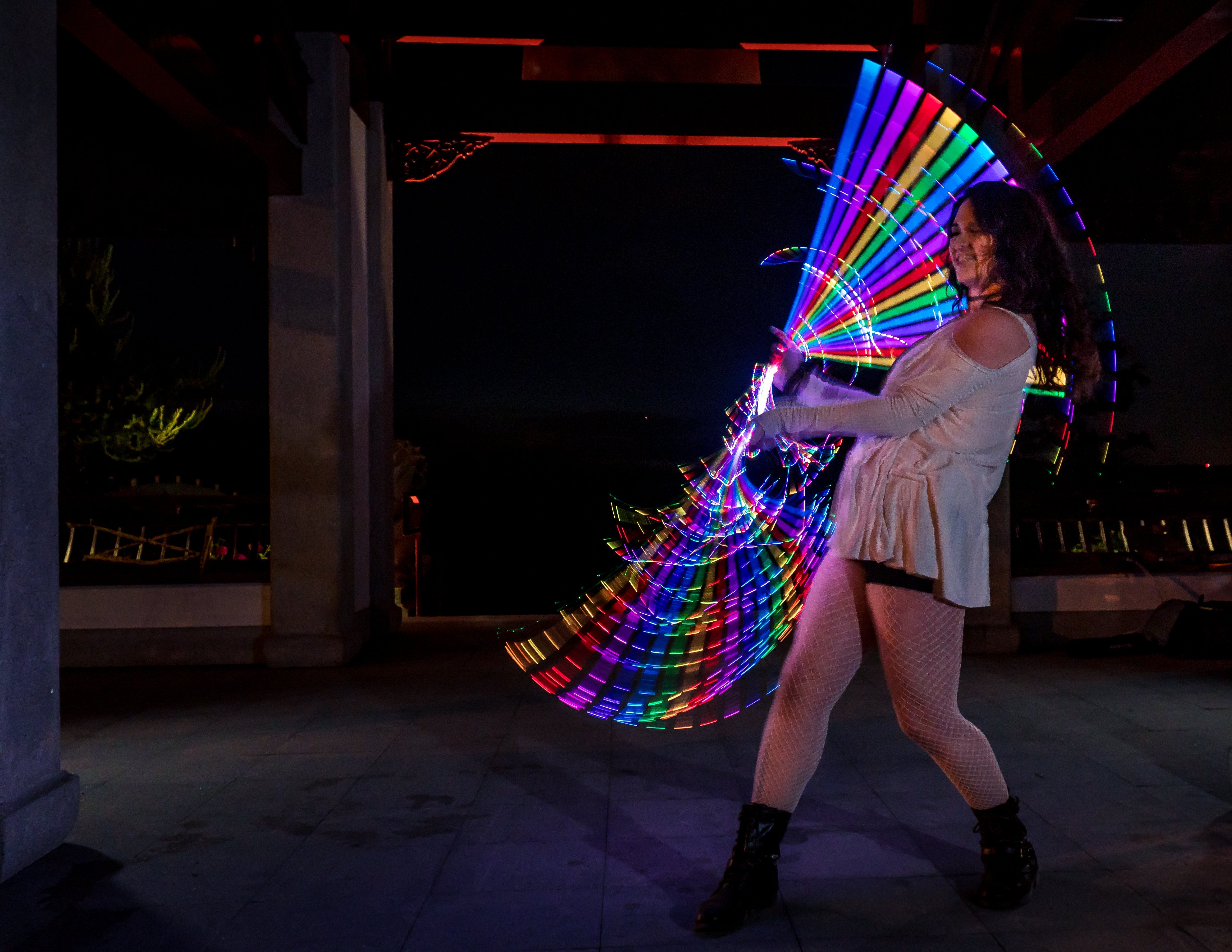 performer spinning whips like poi