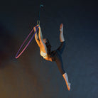 Performer on 1 point aerial hoop