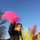 child playing with scarves