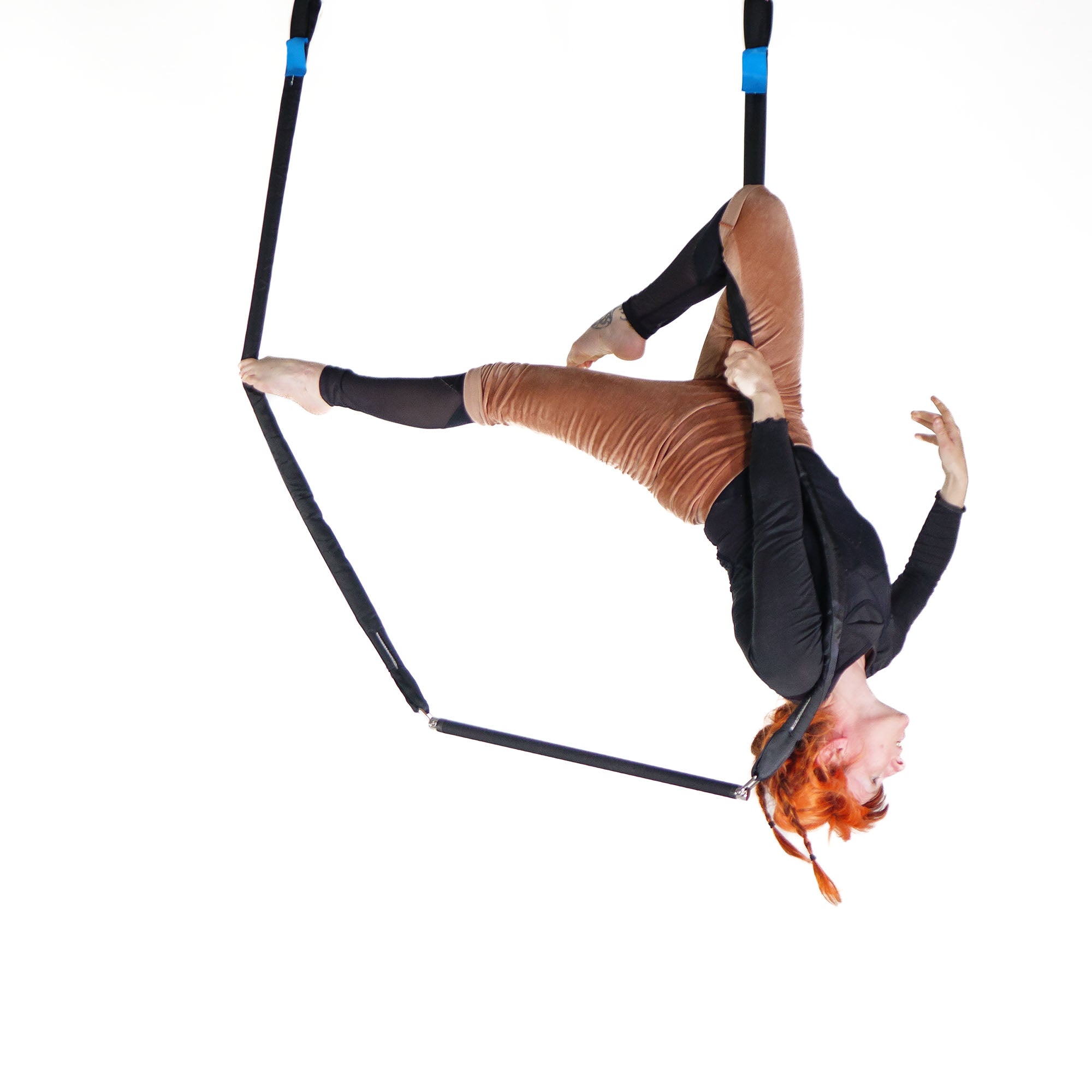 performer on shackle trapeze