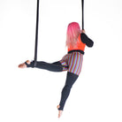 performer on shackle trapeze